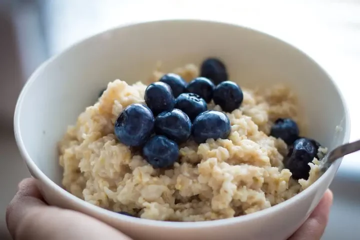 a bowl of oatmeal with blueberries