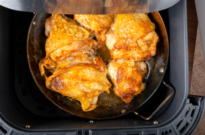 crispy chicken in a pan inside air fryer