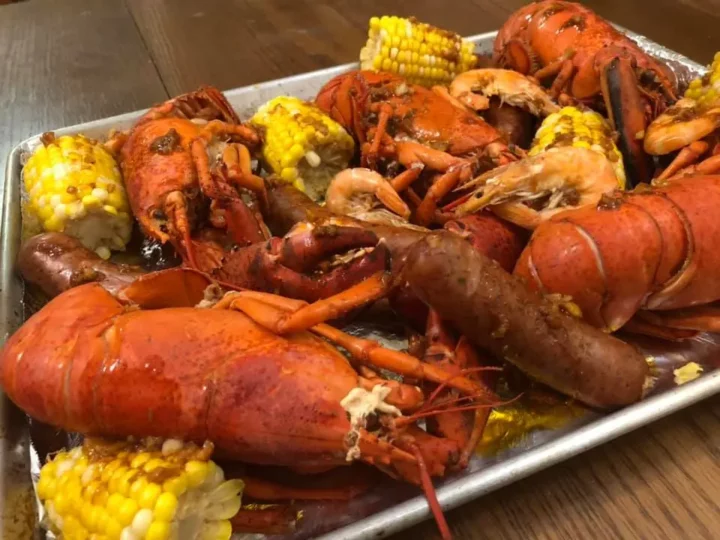 seafood boil with vegetables and sausages